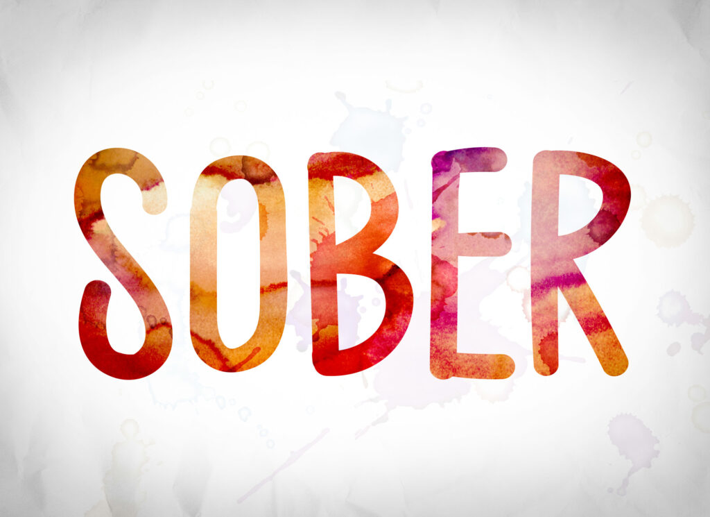 the word SOBER in red with off white background