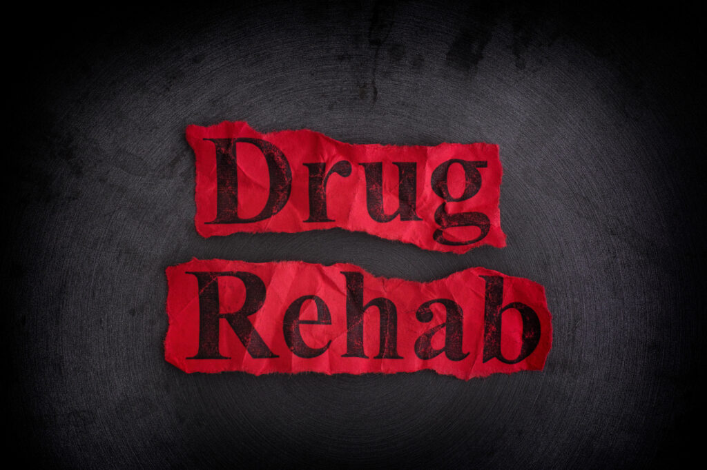 The word Drug Rehab written highlighted in red with black background
