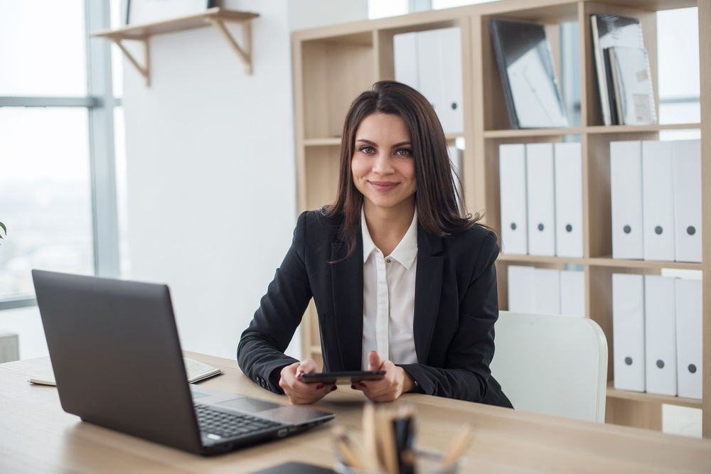 Young women sitting at desk in office